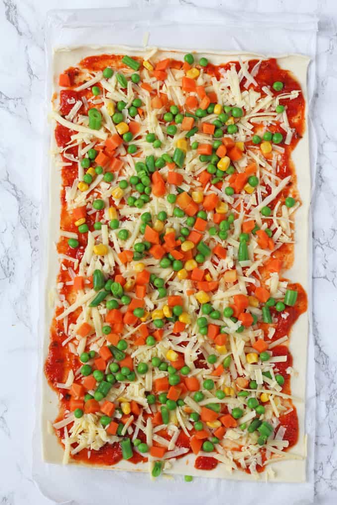Super easy to make and packed with mixed vegetables, these Veggie Pizza Puff Pastry Roll Ups are sure to go down a treat with the whole family!