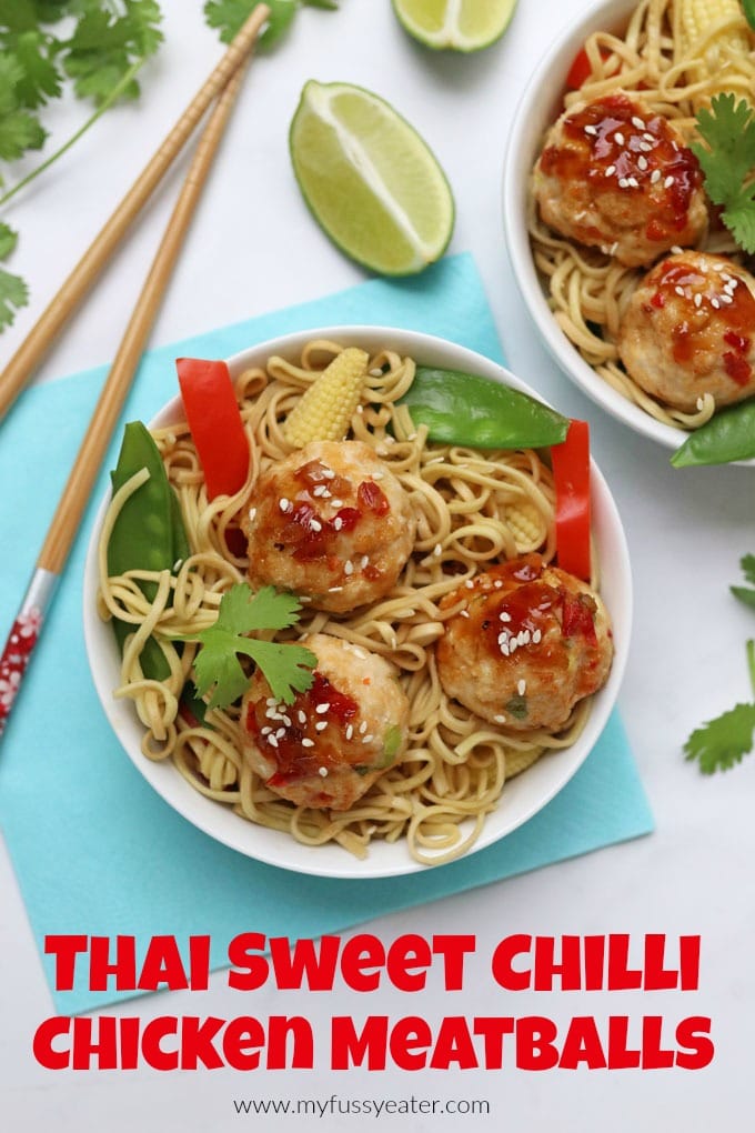 Sweet chili chicken meatballs served in a white bowl with noodles and chopped veggies.