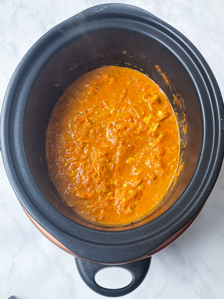 the cream now stirred into the rest of the cooked ingredients in the slow cooker dish.