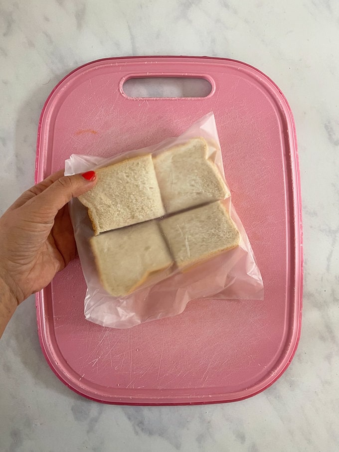 Made sandwiches cut into four and added to a clear sandwich bag ready for freezing.