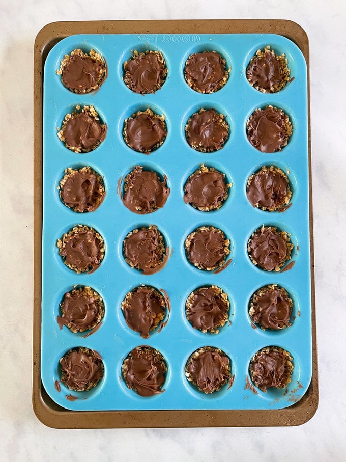 Chocolate added to the top of each cup.