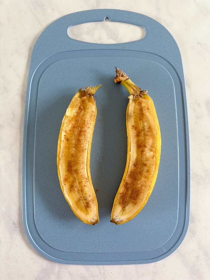 Cinnamon sprinkled over cut banana