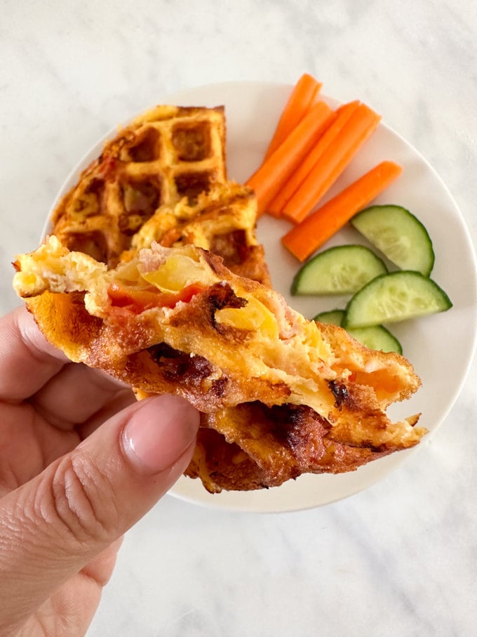 Close up photo of the filling inside the waffle. We used cherry tomatoes,peppers,ham and grated cheese.
