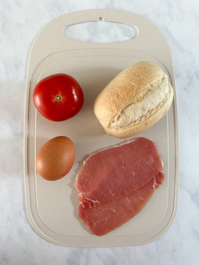 Raw Ingredients all arranged on a plastic chopping board.