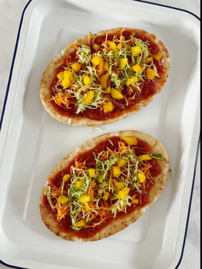Pitta bread with toppings added.