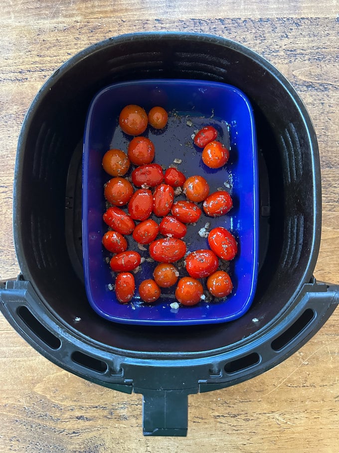 Tomato's placed in the airfryer ready to be cooked.