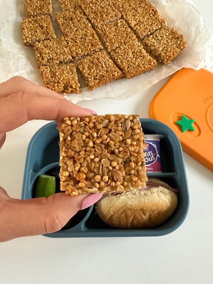 Quinoa Flapjacks served in a bright and colorful child's lunch box.