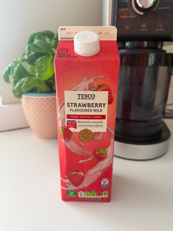 A large carton of Strawberry flavoured milk